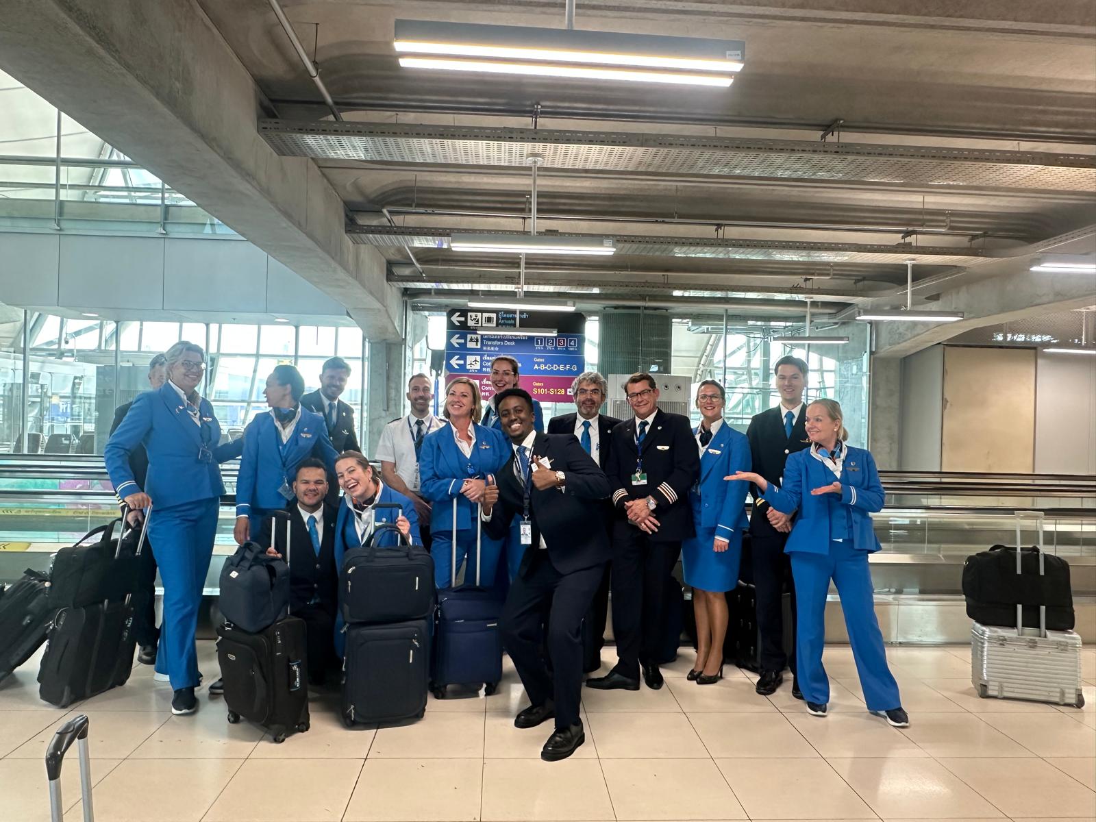 Team photo with airline crew at the departure gates