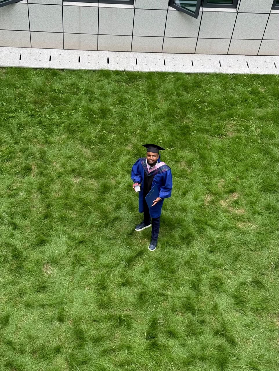 Celebrating on campus lawn after the ceremony